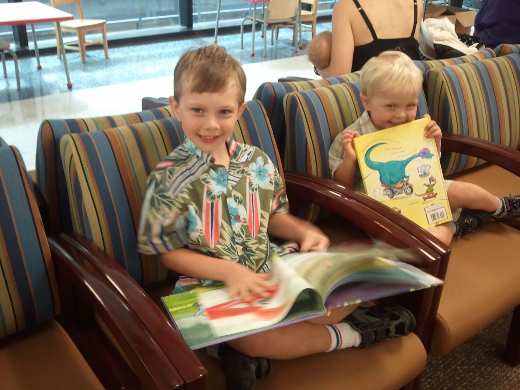 Children enjoying their new books at Walter Reed